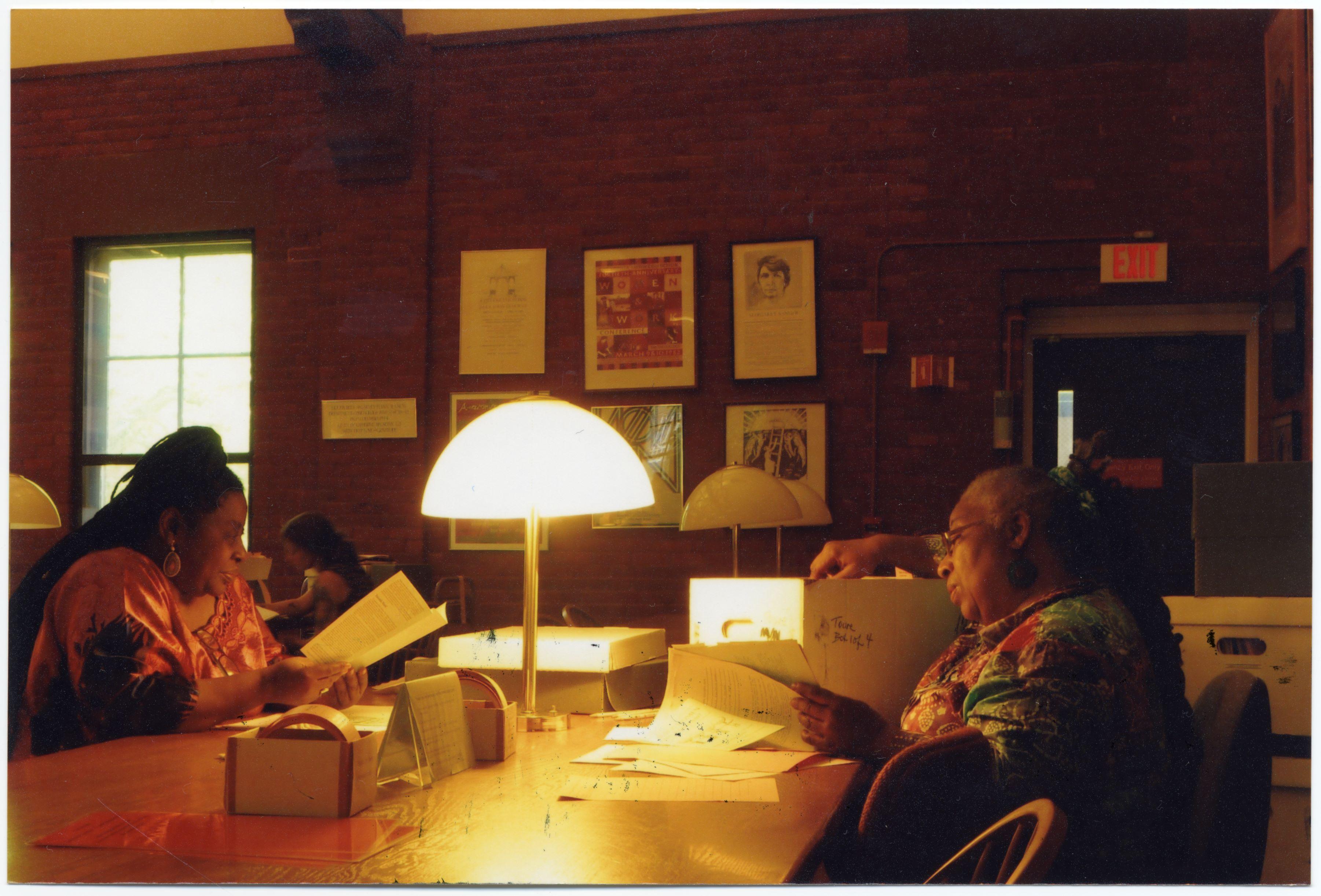 Women sitting at a table in a library