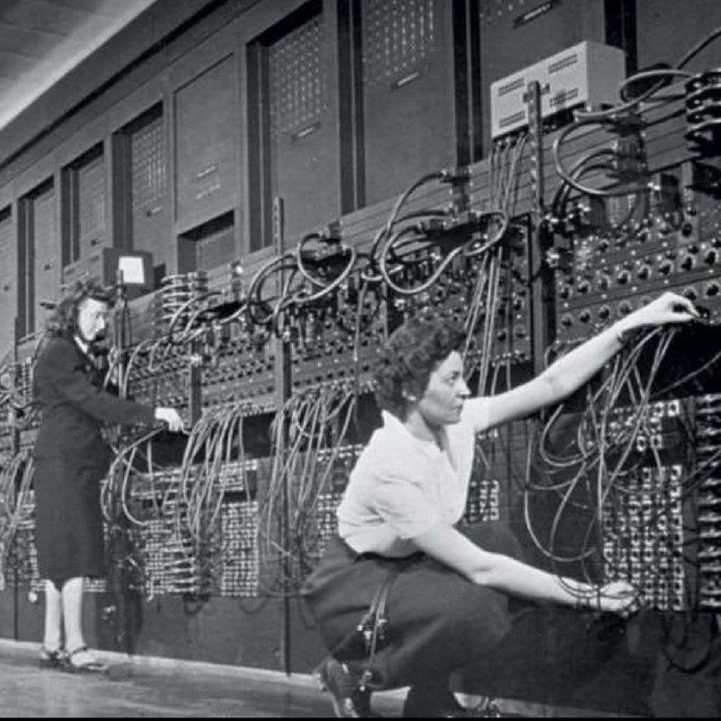 Women computer programmers working with an ENIAC