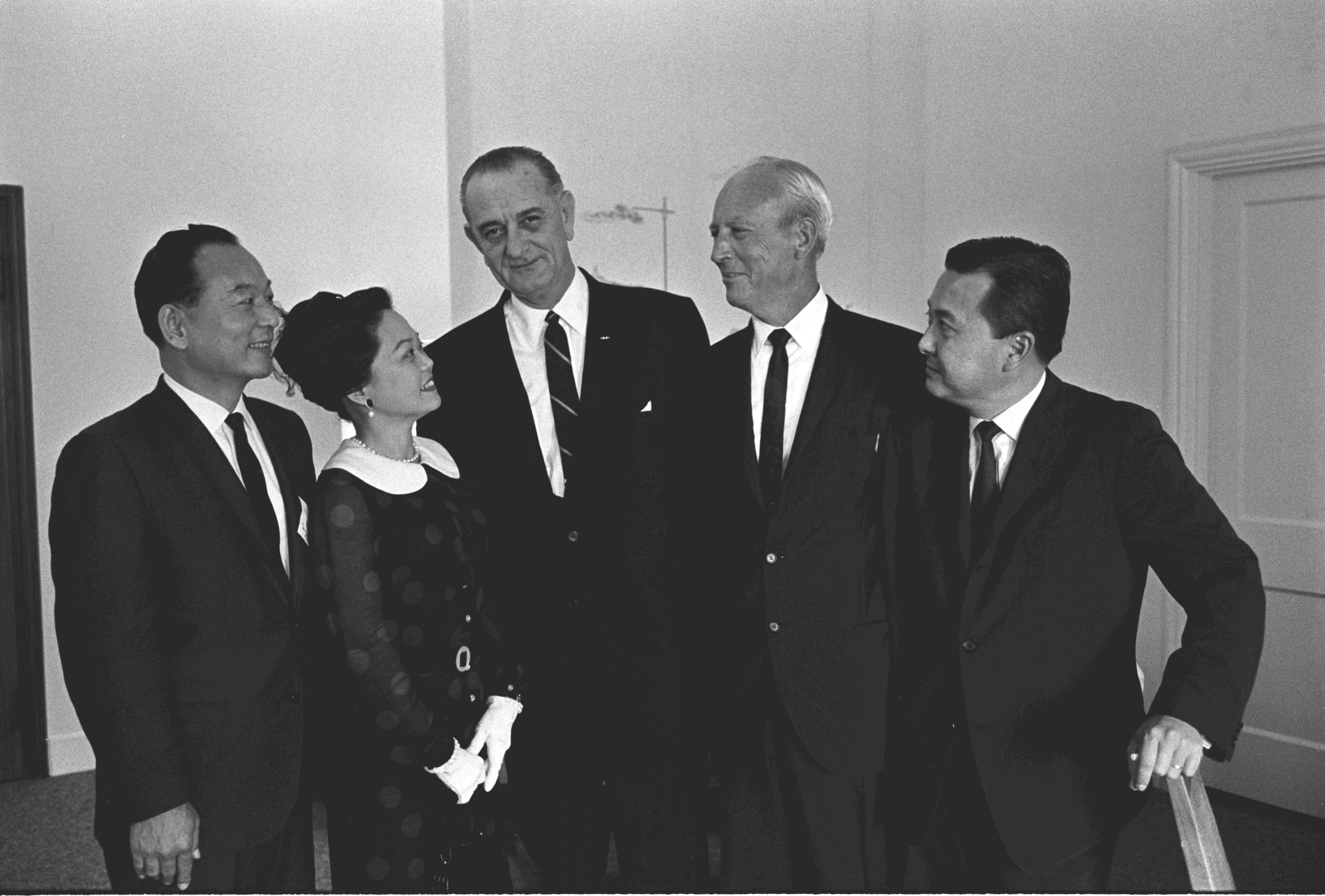 President Lyndon B. Johnson (center) posing with Hawaiian Democrats after church (L-R) Congressman Spark Matsunaga, Congresswoman Patsy Mink, President Johnson, Governor John Burns, Senator Daniel Inouye.