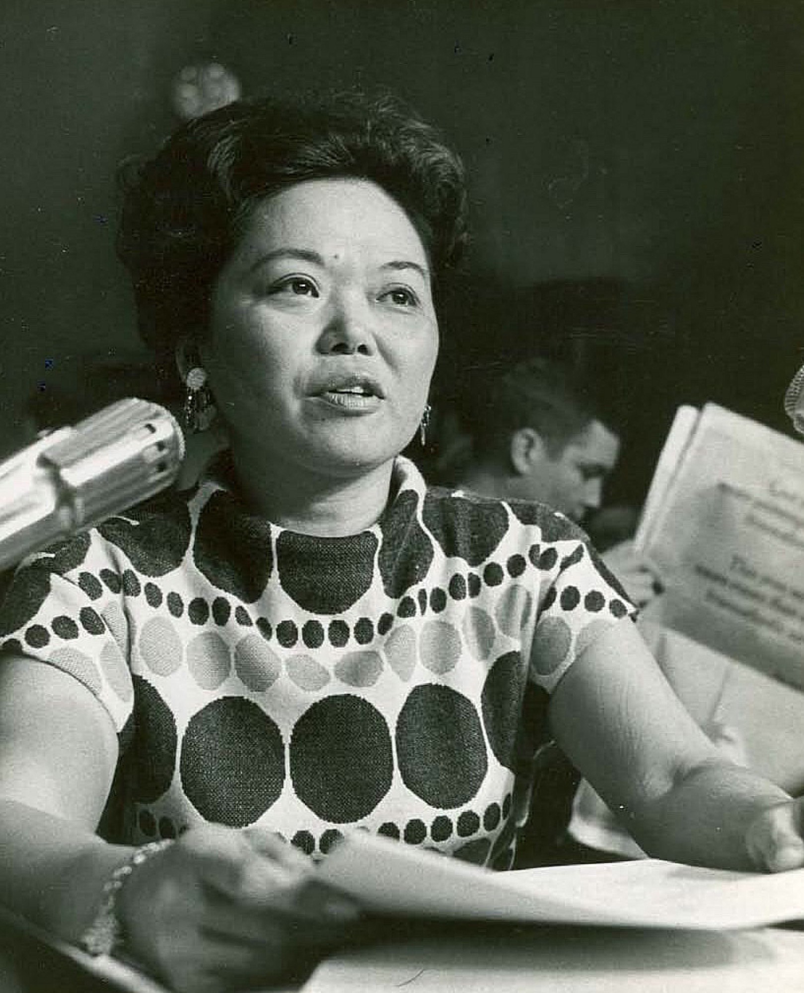 Patsy Mink wearing polka dot top offering the first feminist critique of a supreme court nominee in testimony before the Senate Judiciary Committee, winter 1970.