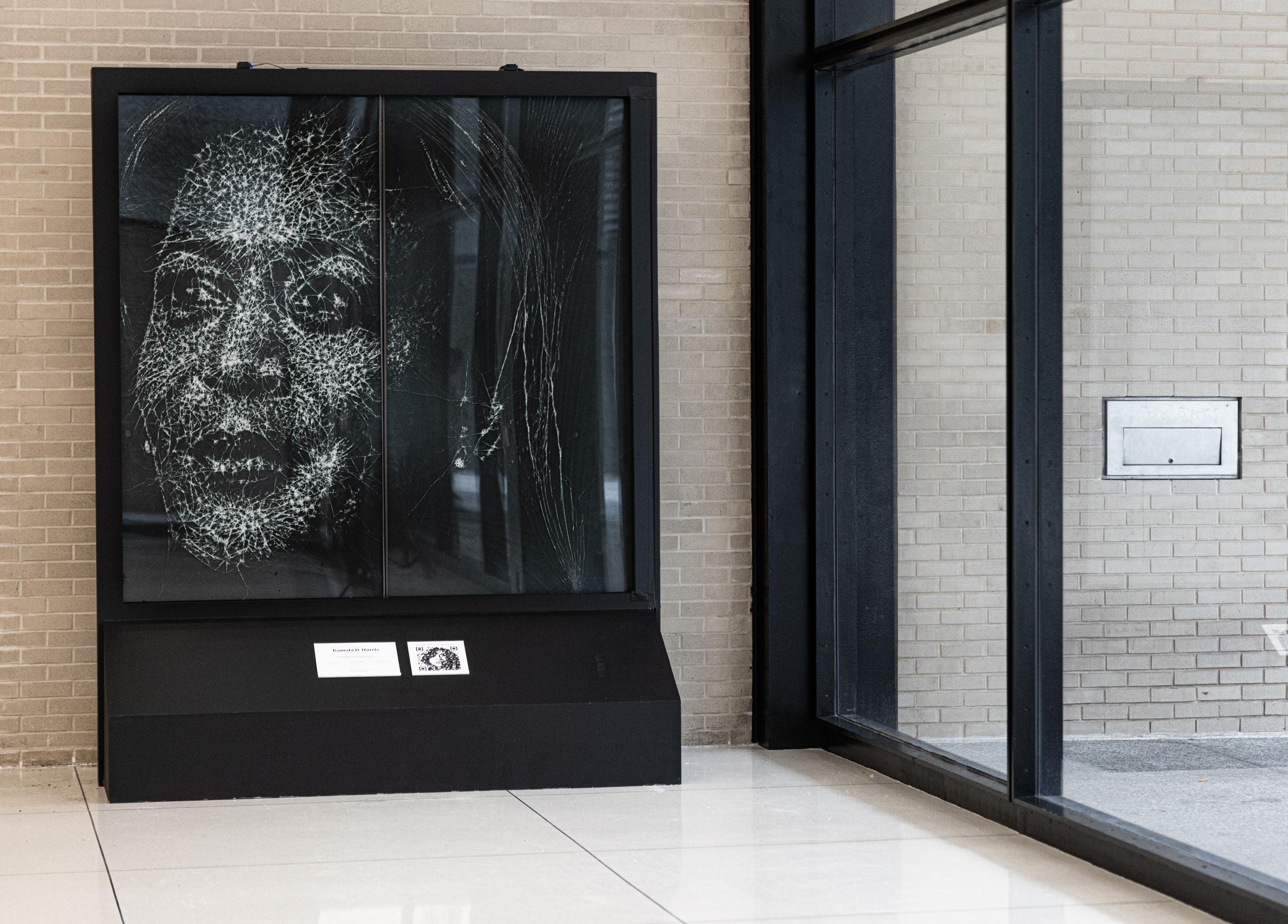 The Glass Ceiling Breaker installation, a portrait of Vice President Kamala Harris' face made of shattered glass.