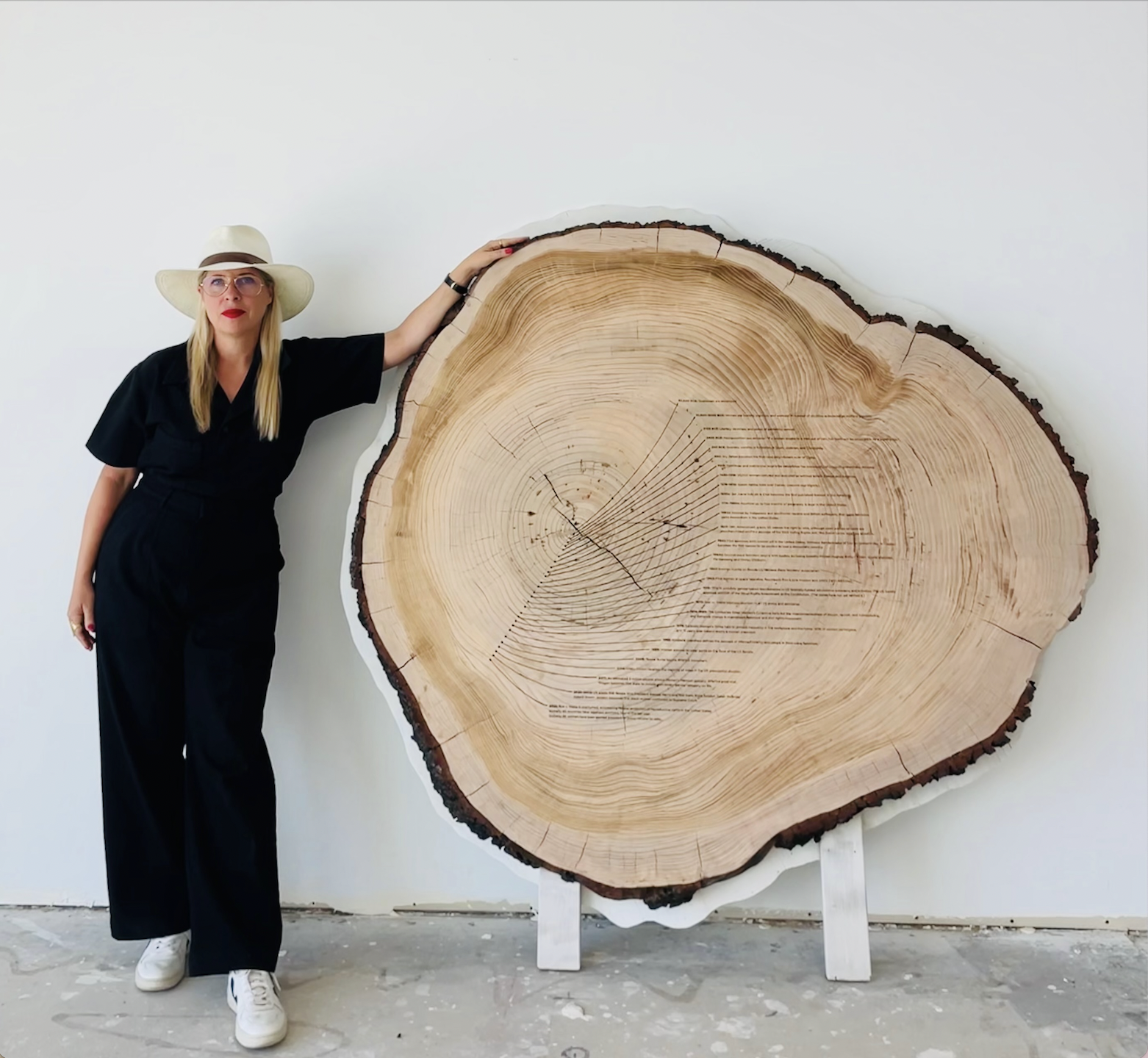 Artist Tiffany Shlain poses with her piece, Dendrofemonology: Feminist History Tree Ring.