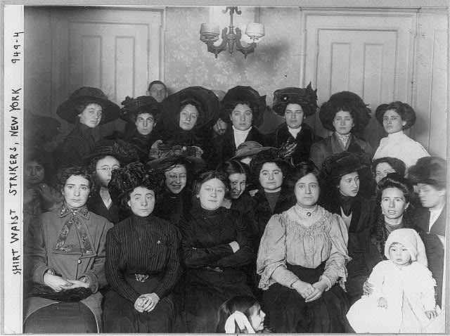 Black and white group photo of woman well dressed.