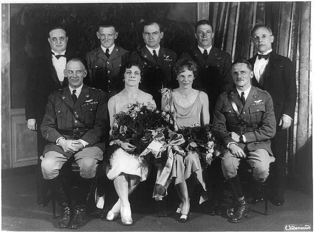 Carl Spaatz and Amelia Earhart posed with seven other people