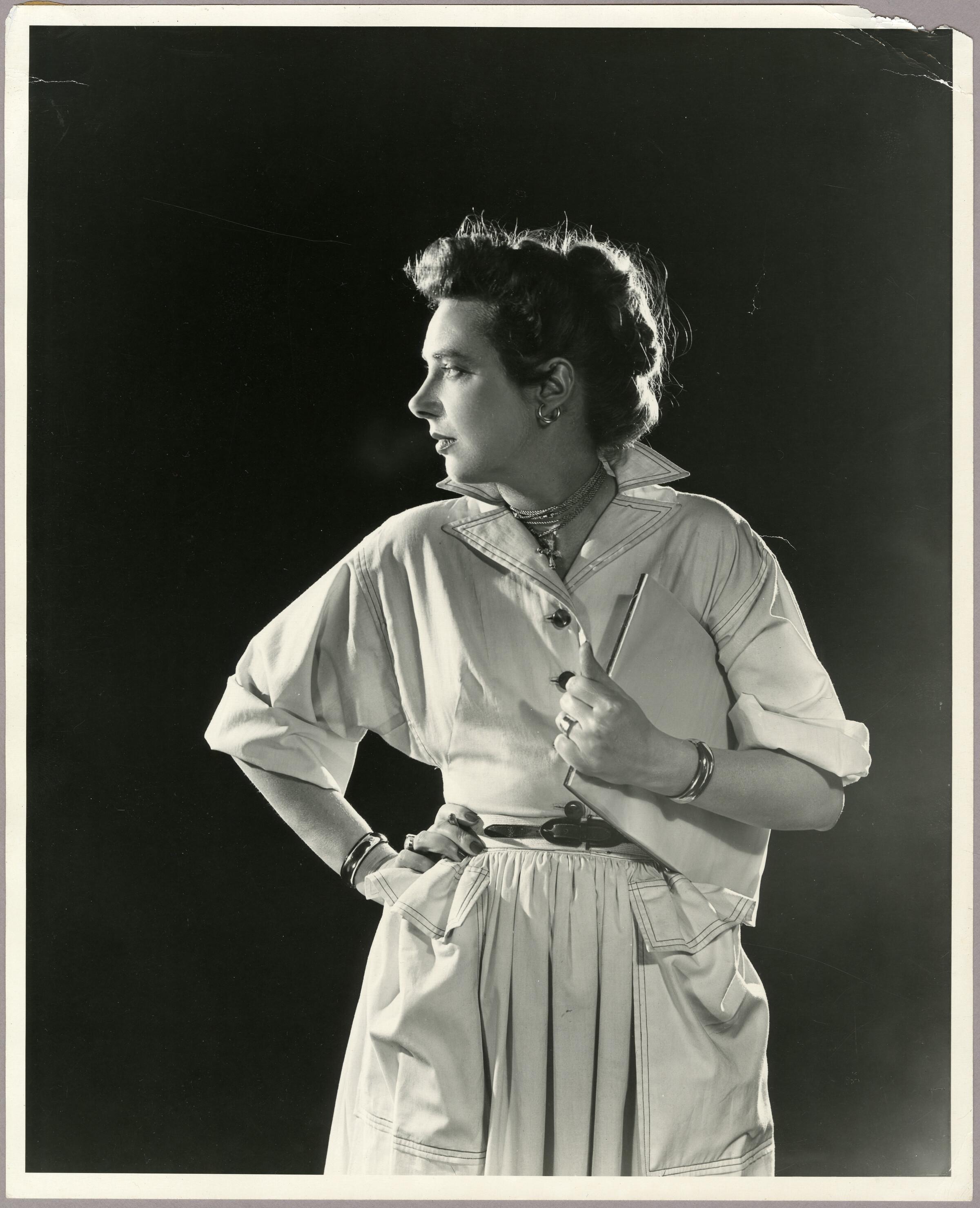 Claire McCardell holding notepad