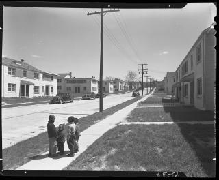 Young residents of Barry Farms Dwellings stand outside of their building shortly after they had been built in 1942.