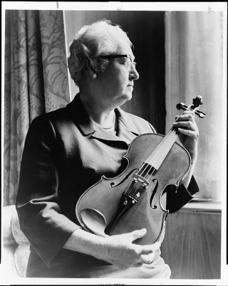 Apgar poses with a violin