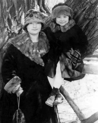 Black & white photo of Elion, age 3, with her mother.