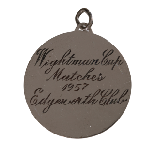 Wightman Cup Matches 1957 Edgeworth Club engraved on a medal.