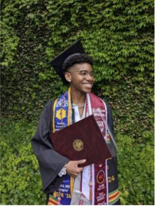 Kihana Wilson Stands Smiling Celebrating her Graduation