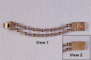 Photo of bracelet owned by Freeman that appears to be gold or bronze.