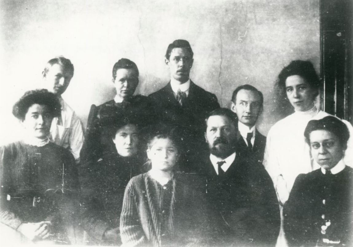 Black and white photo of ten people. 