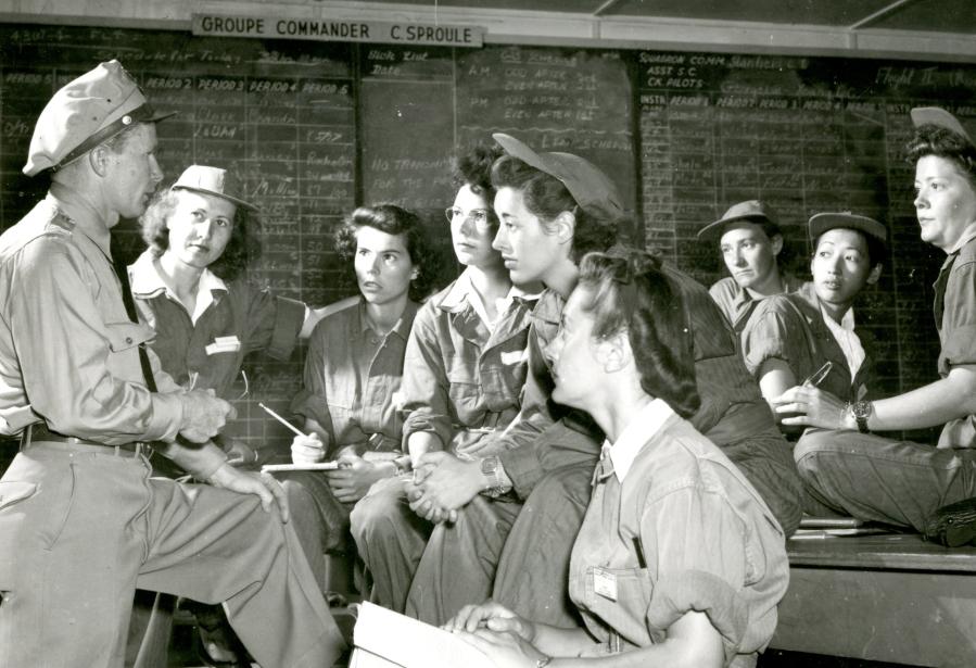 Black and white photo of WASPs being trained at Avenger Field. Hazel Ying Lee is the second woman from the right in the center.