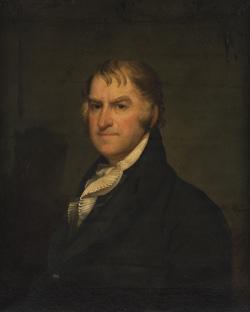 Portrait of Theodore Sedgwick wearing a black suit in front of a dark backdrop.