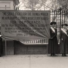Suffragettes protest President Wilson in front of the White House.